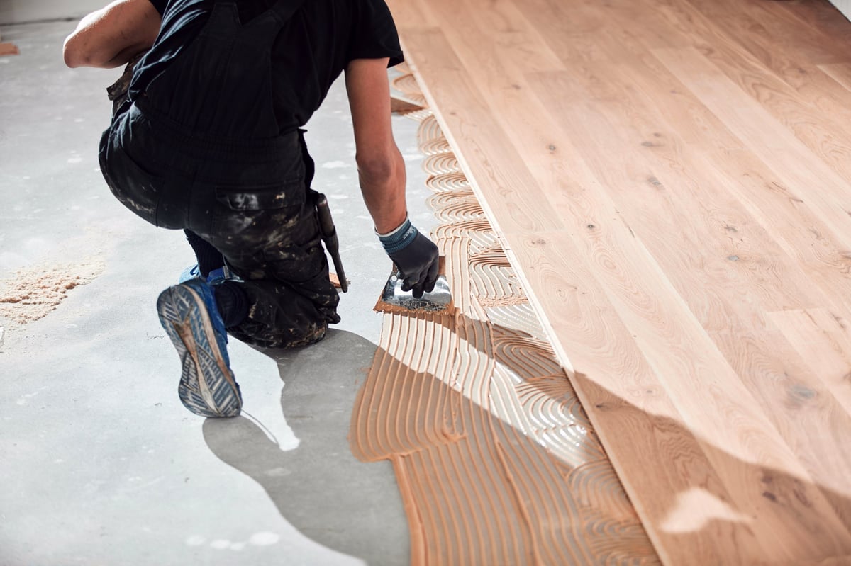 Wood plank flooring being installed in a Central PA living room